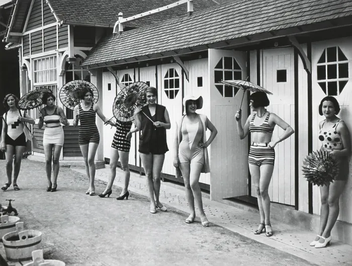Framed Print : French women pose in the latest fashionable bathing suits outside their beach cabanas at Dieppe. Ca. 1925. (BSLOC_2015_17_203) Framed Print : French women pose in the latest fashionable bathing suits outside their beach cabanas at Dieppe. Ca. 1925. (BSLOC_2015_17_203)