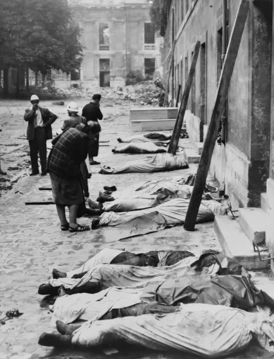 Framed Print : Friends and relatives look for their dead FFI (French Forces of the Interior) fighters. Their bodies are wrapped in sheets, lined up against building, possibly in Paris. Ca