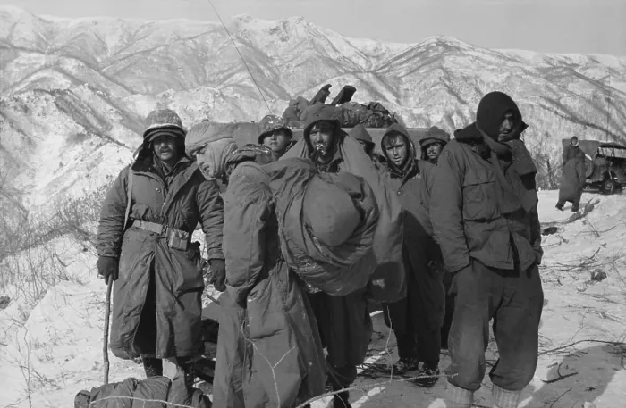 Framed Print : Frostbite casualties of U.S. Marines await air evacuation from the Chosin Reservoir Framed Print : Frostbite casualties of U.S. Marines await air evacuation from the Chosin Reservoir