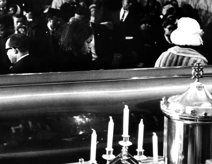 Framed Print : Funeral of Malcolm X. Betty Little Shabazz, widow of slain African American Black Muslim leader Malcolm X, walks away from her husbands coffin funeral services. February 27, 1965