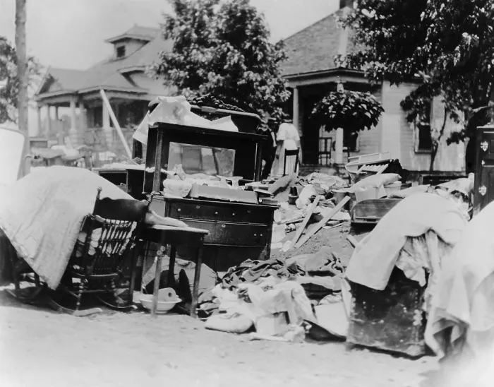 Framed Print : Furniture and belongings in Tulsa street during race riot of May 31 - June 1, 1921. Original caption states the owner was probably evicted during the riot. Photo by Alvin C