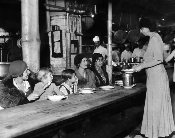 Framed Print : Future First Lady Eleanor Roosevelt (standing, right), serving meals to unemployed women at a restaurant in New York, December 1, 1932