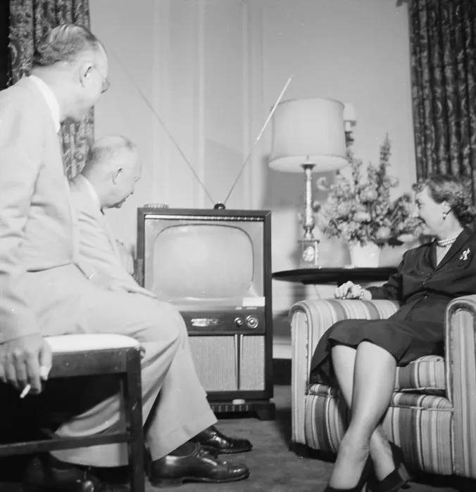 Framed Print : Future President Dwight D. Eisenhower (back left), and future First Lady Mamie Eisenhower, watch the Republican National Convention on television, photograph by Thomas J