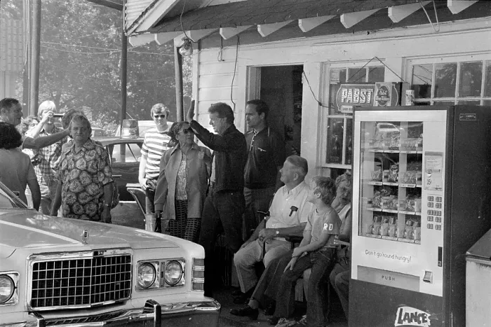 Framed Print : Future President Jimmy Carter (center, waving), makes a campaign stop at his brother Billy's gas station in their hometown of Plains, Georgia, photograph by Thomas J