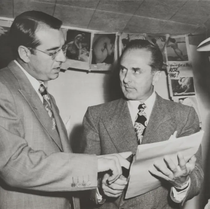 Framed Print : Gangster Johnny Rosselli (right) checks a writ of habeas corpus with his lawyer, Frank Desimone. On July 28, 1948 Rosselli surrendered to the U.S