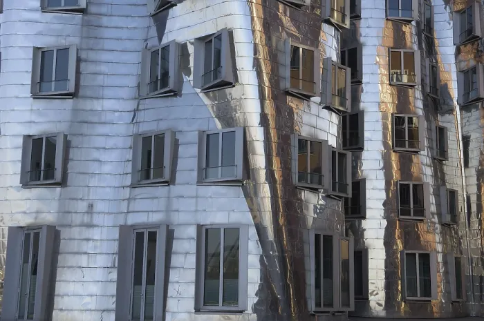 Framed Print : GEHRY, Frank (1929). GERMANY. Dsseldorf. Building complex located at the Media harbour. Detail of the Neuer Zollhof 2 or middle building, with mirror surface (1998). Architecture