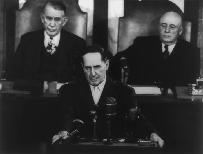 Framed Print : Gen. Douglas MacArthur delivering his farewell address to a joint session of Congress. Behind him are Vice-President Alben Barkley and House Speaker Sam Rayburn. April 19, 1951 Framed Print : Gen. Douglas MacArthur delivering his farewell address to a joint session of Congress. Behind him are Vice-President Alben Barkley and House Speaker Sam Rayburn. April 19, 1951