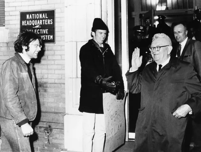 Framed Print : Gen. Lewis Hershey waves to protesters outside the Selective Service HQ after draft lottery. Dec. 1, 1969. (CSU_2015_9_956) Framed Print : Gen. Lewis Hershey waves to protesters outside the Selective Service HQ after draft lottery. Dec. 1, 1969. (CSU_2015_9_956)
