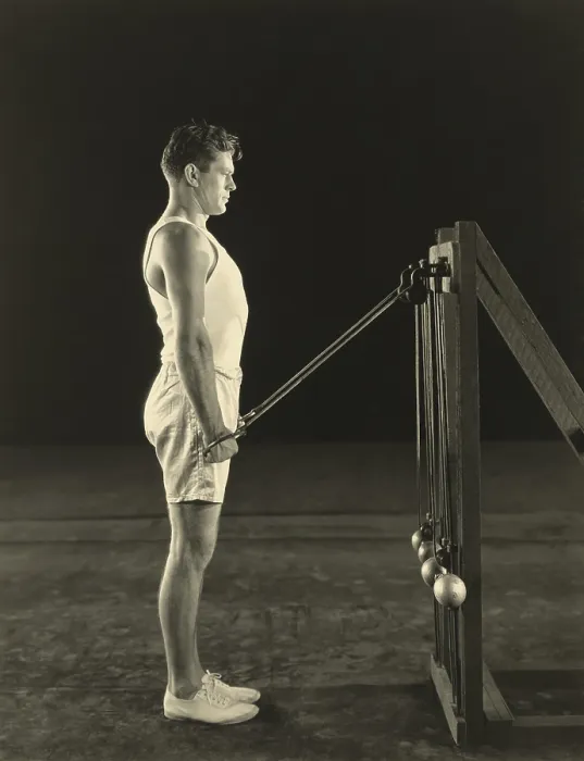 Framed Print : Gene Tunney, World Heavy Weight Champion lifting weights on pulleys. Ca. 1926. (BSLOC_2015_14_214)