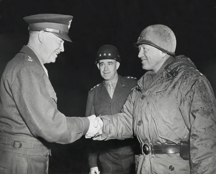 Framed Print : General Dwight Eisenhower shakes hands with Gen. George Patton at the front in 1945. Patton is in battle dress. Gen. Omar Bradley stands in the background. (BSLOC_2013-12_99) Framed Print : General Dwight Eisenhower shakes hands with Gen. George Patton at the front in 1945. Patton is in battle dress. Gen. Omar Bradley stands in the background. (BSLOC_2013-12_99)