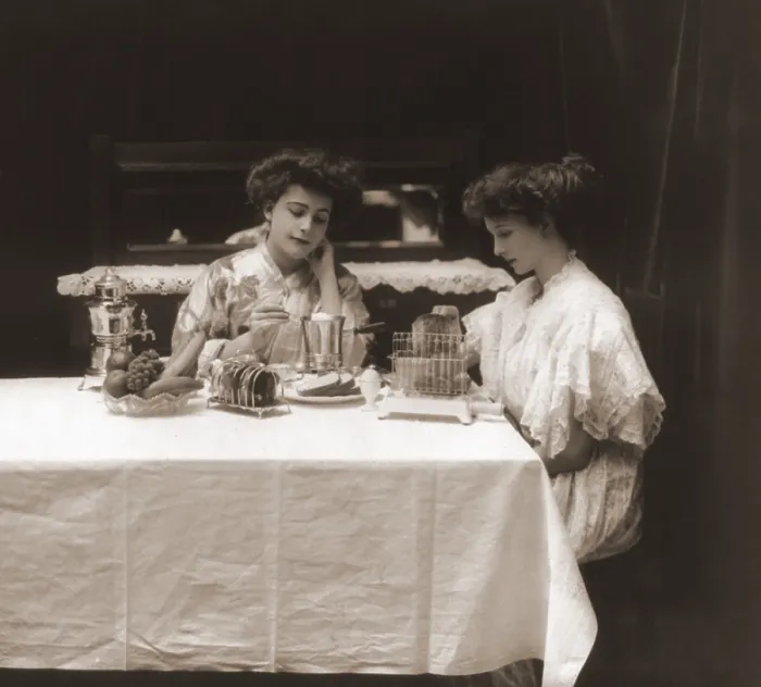 Framed Print : General Electric advertising photo of women using electric appliances, a toaster, coffeepot and egg poacher. Ca. 1908
