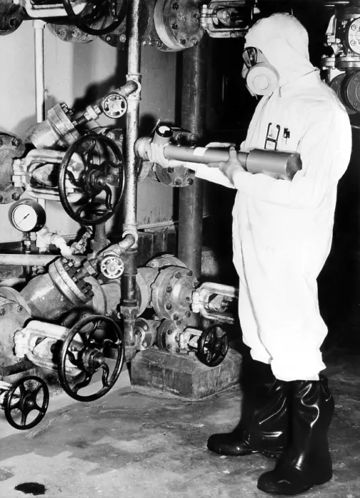 Framed Print : General Electric worker with a portable radiation detector checking for probable hot zones at the Hanford Atomic Products Operation, Richland, WA, 1955