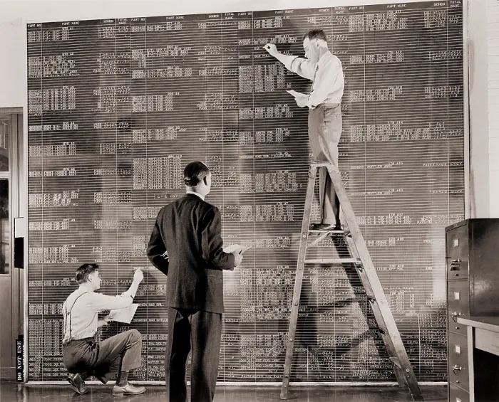 Framed Print : General Motors managers at a large control board, which resembles a spreadsheet, keep check on flow of materials needed for the wartime production. 1941 Framed Print : General Motors managers at a large control board, which resembles a spreadsheet, keep check on flow of materials needed for the wartime production. 1941