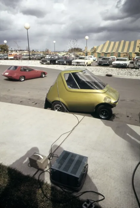 Framed Print : An General Motors urban electric car gets battery charge at a 1973 Environmental Symposium in Ann Arbor Michigan. In the background is the electric SUNDANCER. Oct. 1973 Framed Print : An General Motors urban electric car gets battery charge at a 1973 Environmental Symposium in Ann Arbor Michigan. In the background is the electric SUNDANCER. Oct. 1973