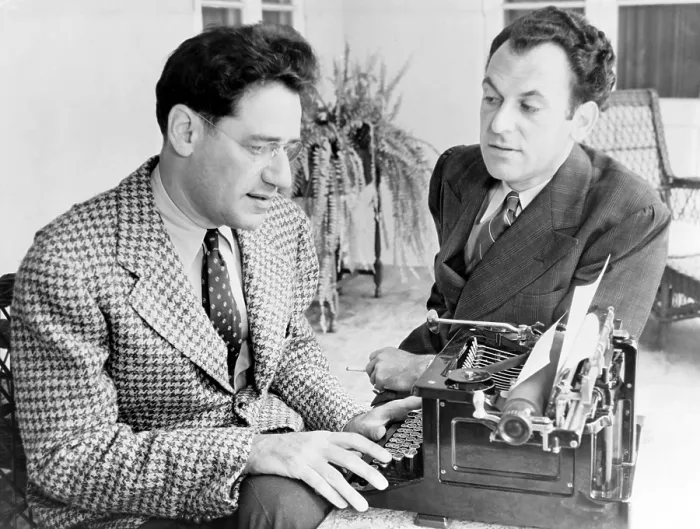 Framed Print : George S. Kaufman (1889-1961) typing while Moss Hart (1904-1961) talks, in 1937, the year their play, YOU CAN'T TAKE IT WITH YOU, won the Pulitzer Prize Framed Print : George S. Kaufman (1889-1961) typing while Moss Hart (1904-1961) talks, in 1937, the year their play, YOU CAN'T TAKE IT WITH YOU, won the Pulitzer Prize