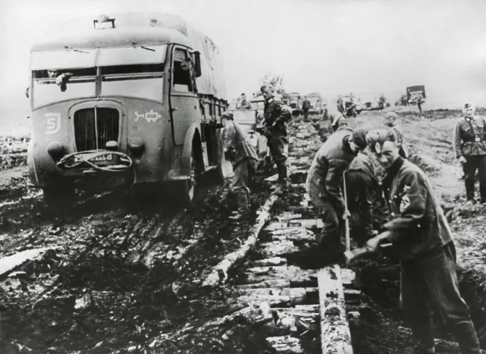 Framed Print : German army fights the autumn mud to supply the army in Stalingrad in Oct. 1942. Roadbuilders have laid logs to create a road bed, but it is still incomplete and unstable