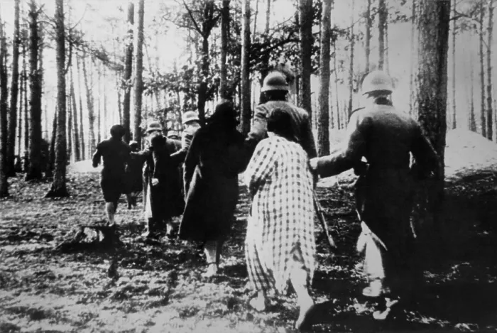 Framed Print : German atrocities in Poland ca. 1941. Polish women led by soldiers through woods to their execution during World War 2. (BSLOC_2013_11_37)