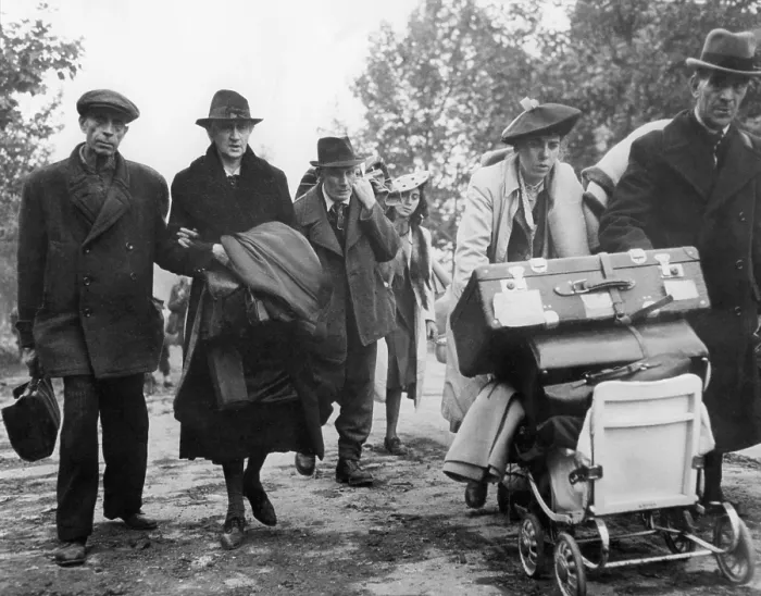Framed Print : German civilian refugees moved through the streets of Aachen, Germany, in Oct. 1944. They carry possessions to a safe area behind the U.S. first Army lines
