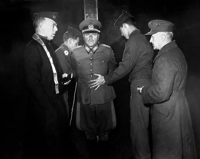 Framed Print : German Gen. Anton Dostler tied to a stake before his execution on Dec. 1, 1945. He was convicted of ordering the execution of 15 U.S. Army commandos in Italy in March 1944 Framed Print : German Gen. Anton Dostler tied to a stake before his execution on Dec. 1, 1945. He was convicted of ordering the execution of 15 U.S. Army commandos in Italy in March 1944