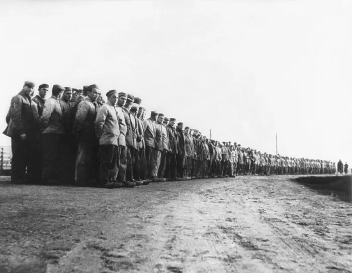 Framed Print : German political prisoners at a labor camp in 1935. Hundreds of prisoners stand in long rows, at a concentration camp in the Emsland region of Germany. Photo by Walter Talbot