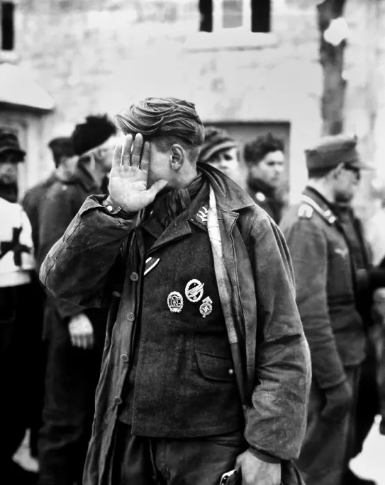 Framed Print : German prisoner captured during the Battle of the Bulge declines to be photographed. He was captured by the U.S. 16th Infantry Regiment, near Weywertz, Belgium. Jan