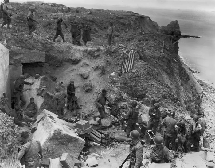 Framed Print : German prisoners captured by U.S. Rangers on Pointe du Hoc, during D-Day Invasion. The American flag signals the position is in U.S. hands to prevent friendly fire from tanks Framed Print : German prisoners captured by U.S. Rangers on Pointe du Hoc, during D-Day Invasion. The American flag signals the position is in U.S. hands to prevent friendly fire from tanks