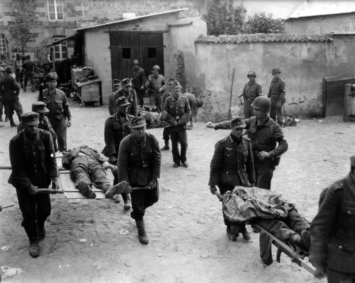 Framed Print : German prisoners carry their fallen comrades for burial at Brehal, France. Guarded by U.S. Military Police, the POW's were captured during the U.S. offensive, Operation Cobra Framed Print : German prisoners carry their fallen comrades for burial at Brehal, France. Guarded by U.S. Military Police, the POW's were captured during the U.S. offensive, Operation Cobra