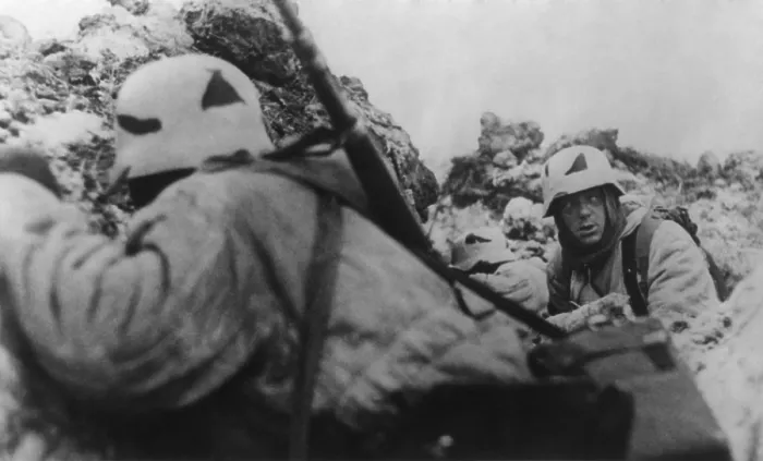 Framed Print : German soldiers crouching behind earthworks near Leningrad during Soviet (Russian) bombardment. Ca. 1943 during World War 2. (BSLOC_2014_8_38)