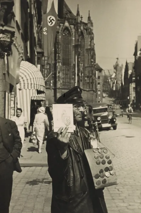 Framed Print : German street vendor sells Nazi political buttons on the street. Ca. 1930. (BSLOC_2014_7_3) Framed Print : German street vendor sells Nazi political buttons on the street. Ca. 1930. (BSLOC_2014_7_3)