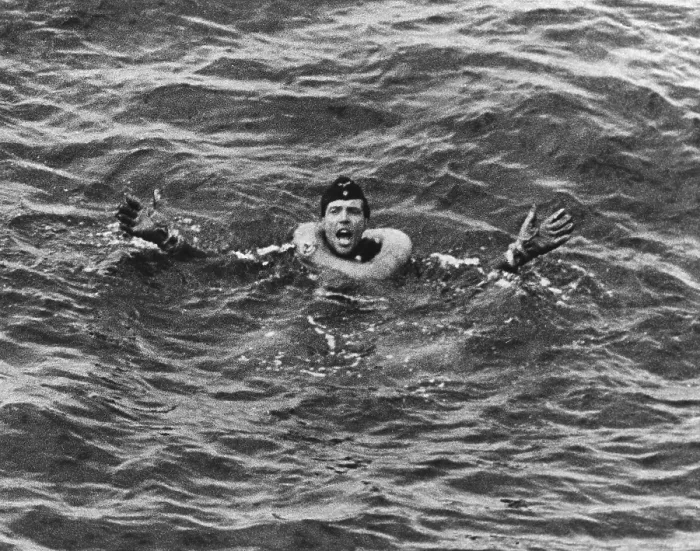 Framed Print : German submariner from U-175 has a life ring around his neck. He gestures for help while awaiting rescue in the Atlantic Ocean during World War 2, ca. 1941-43. (BSLOC_2013_11_112)