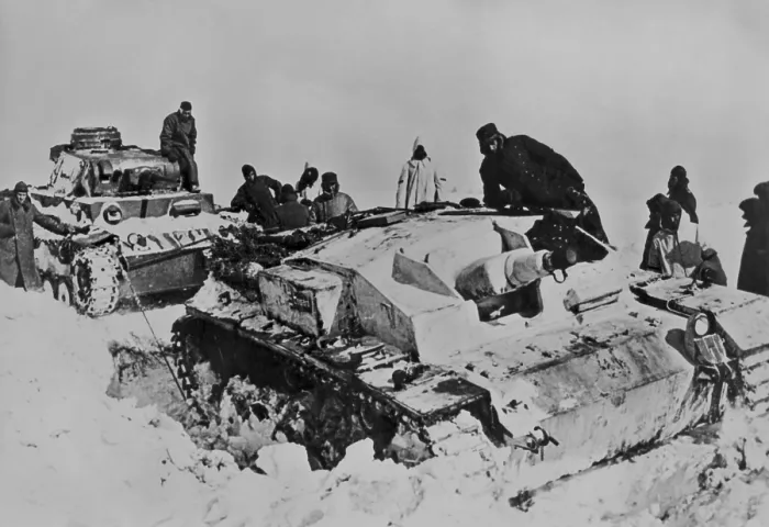 Framed Print : German tank stuck in heavy snow in Russian in April 1942. Soldiers use the tank on left is attempting to free the immobilized vehicle. (BSLOC_2013-12_4)