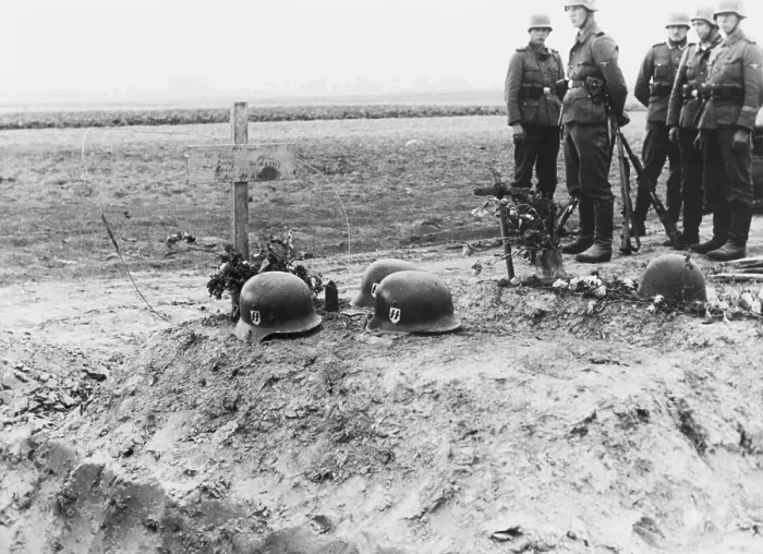 Framed Print : German Waffen-SS troops at the helmet topped graves of their fellows during the invasion of Poland. Sept. 1939. World War 2. (BSLOC_2014_7_61) Framed Print : German Waffen-SS troops at the helmet topped graves of their fellows during the invasion of Poland. Sept. 1939. World War 2. (BSLOC_2014_7_61)