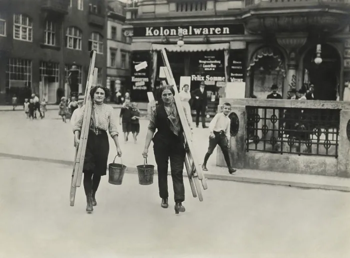 Framed Print : German women window cleaners dressed for work carry their tools in a Berlin street in World War 1. 1914-1918 (BSLOC_2017_2_49)