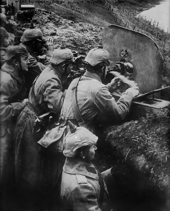 Framed Print : German WW1 machine gun crew firing from a trench on the Eastern Front. 1914-15. (BSLOC_2012_4_127)