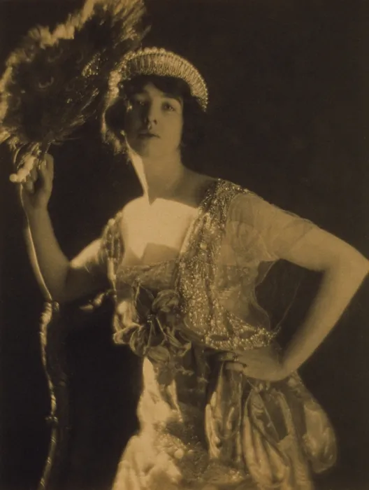 Framed Print : Gertrude Vanderbilt Whitney wearing a jeweled gown and tiara, while holding a peacock feather fan Framed Print : Gertrude Vanderbilt Whitney wearing a jeweled gown and tiara, while holding a peacock feather fan
