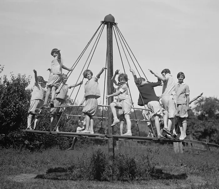 Framed Print : Girls in bloomers on simple merry-go-round, at a Fresh Air Camp of The Child Christ Society, a Catholic lay organization