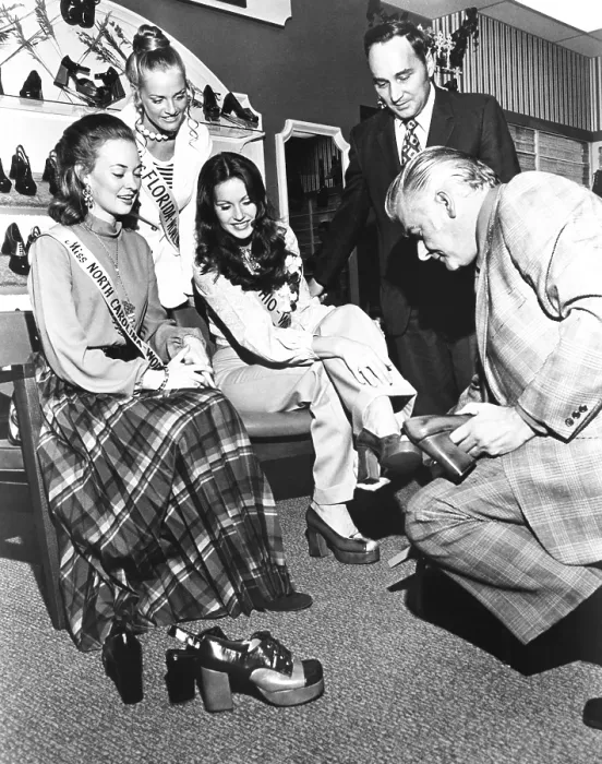 Framed Print : Not so glamourous work for Beauty Queens. Three beauty contestants promote Royce Shoes in an Endicott Johnson store in Binghamton, New York. Oct. 1973