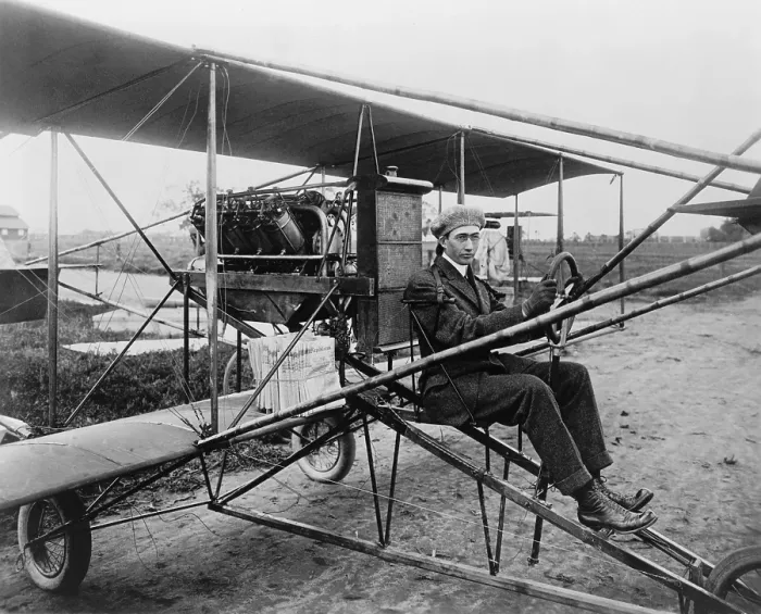 Framed Print : Glenn Martin (1886-1955), delivering newspapers in his airplane. He built his first airplane in 1909, and his first airplane factory in 1912 in Los Angeles, California