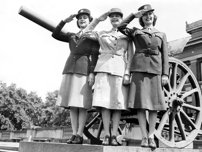 Framed Print : Gloria Pickett, Jane Greer (then Bette Jane Greer), and Inga Rundvold, modeling the uniforms to be worn by the Women's Auxiliary Corps, August 1942, Fort Des Moines, Iowa