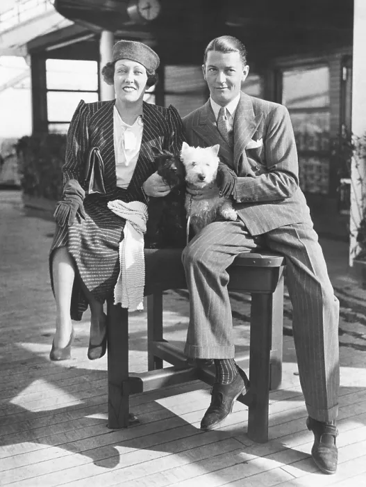Framed Print : Gloria Swanson with her husband, Michael farmer, her 4th husband. March 16, 1933. They arrived in NYC after she produced the English film, PERFECT UNDERSTANDING Framed Print : Gloria Swanson with her husband, Michael farmer, her 4th husband. March 16, 1933. They arrived in NYC after she produced the English film, PERFECT UNDERSTANDING