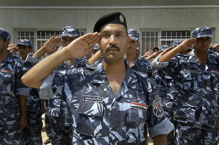 Framed Print : Graduates of the Iraqi Police Academy's salute during the commencement ceremony in Salman Pak Iraq. Aug. 29 2008. (BSLOC_2011_12_149)