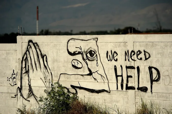 Framed Print : Graffiti asking for help is painted on a wall on January 22 2010 in Port au Prince Haiti. 7.0-magnitude earthquake on January 12 2010. (BSLOC_2011_12_386) Framed Print : Graffiti asking for help is painted on a wall on January 22 2010 in Port au Prince Haiti. 7.0-magnitude earthquake on January 12 2010. (BSLOC_2011_12_386)