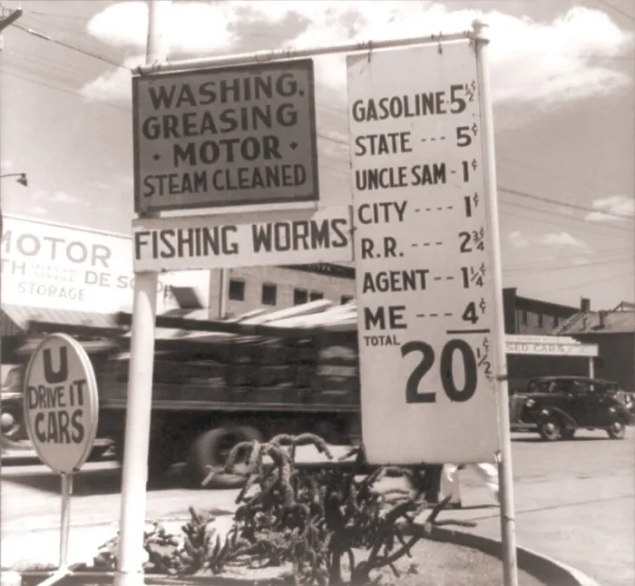 Framed Print : The Great Depression. Gas station sign itemizing taxes and fees imposed by different layers of government that raise the price per gallon. Photo by Dorothea Lange