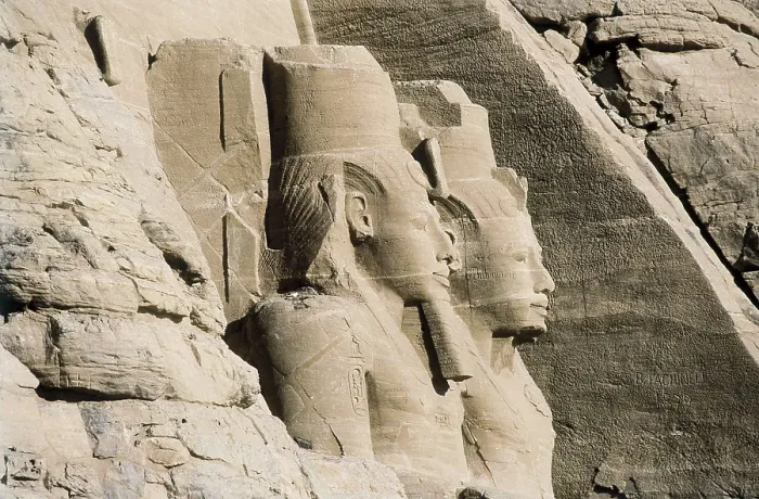 Framed Print : Great Temple of Rameses II. EGYPT. ASWAN. Abu Simbel. Great Temple of Rameses II. Upper section of two of the four colossus that flank the entrance to the Great Temple