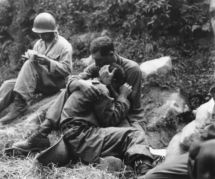 Framed Print : A grief stricken American infantryman whose buddy has been killed in action is comforted by another soldier Framed Print : A grief stricken American infantryman whose buddy has been killed in action is comforted by another soldier