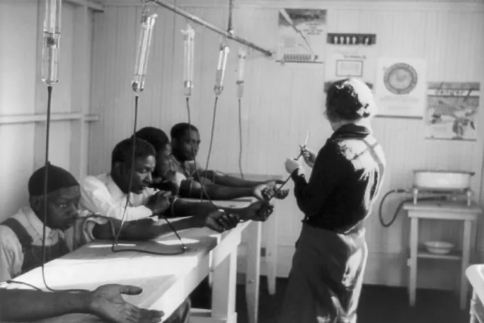 Framed Print : A group of African American men receiving intravenous treatment in a Georgia venereal disease clinic. ca. 1937 Framed Print : A group of African American men receiving intravenous treatment in a Georgia venereal disease clinic. ca. 1937
