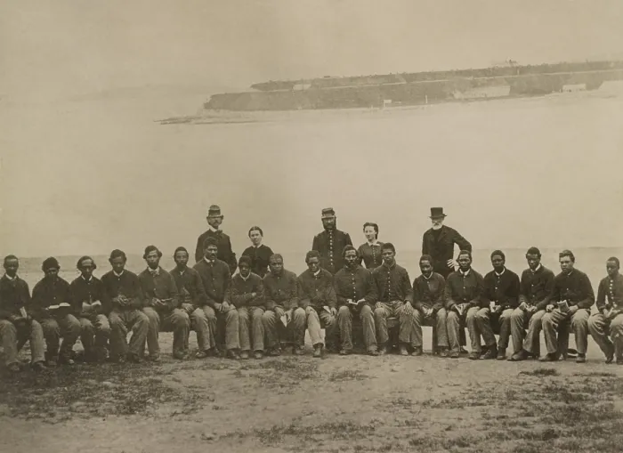 Framed Print : Group portrait of white and African American soldiers seated, many with open books in their laps