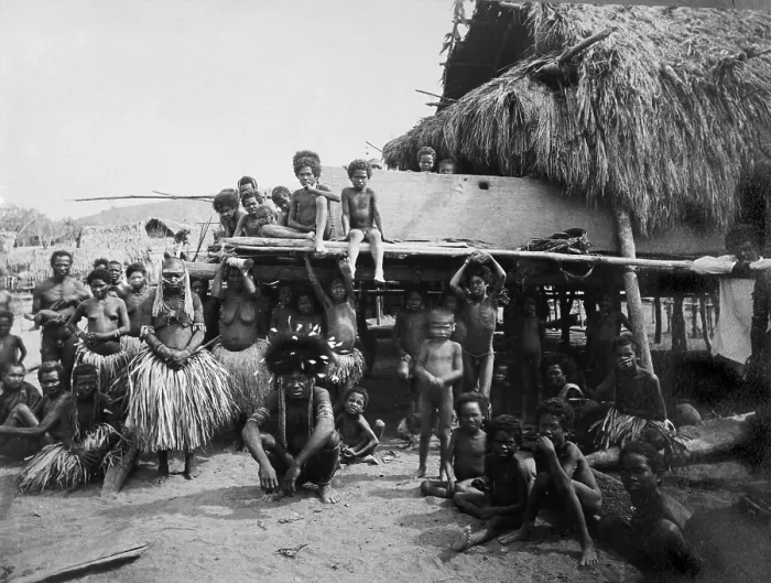 Framed Print : Group of Tongans in traditional costume pose in front of village buildings in 1919. Tonga was a British protectorate from 1900-1970 Framed Print : Group of Tongans in traditional costume pose in front of village buildings in 1919. Tonga was a British protectorate from 1900-1970
