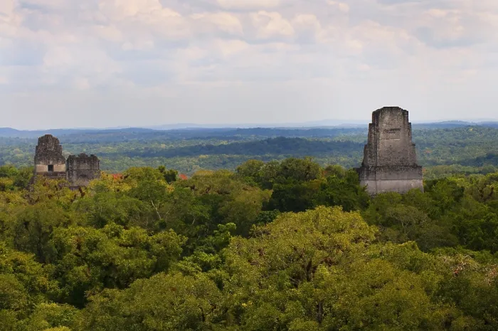 Framed Print : GUATEMALA. Tikal. Tikal National Park. View of the temples I, II and IV standing out the rainforest. Maya art. Architecture