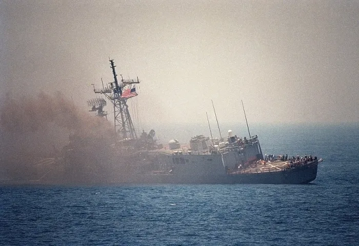 Framed Print : Guided missile frigate USS STARK listing to port after being struck by an Exocet missile launched from an Iraqi jet